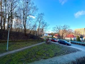 a street with cars parked on the side of a road at MMRent Przytulny apartament w Sopocie in Sopot