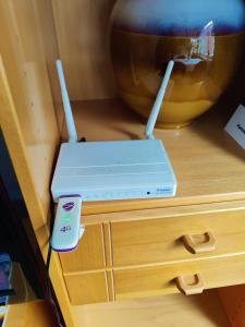 a nintendo wii game system sitting on top of a drawer at City Home Lahti in Lahti