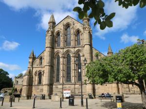 a large cathedral with a tree in front of it at Buzzards Rest in Morpeth