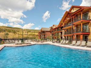 a swimming pool in front of a resort at Fresh SNOW! Exquisite Upscale Oasis · Ski Resort in Breckenridge