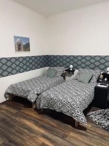 מיטה או מיטות בחדר ב-Mázli Vendégház