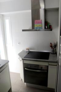 a kitchen with a sink and a counter top at La morada del viajero in Granada