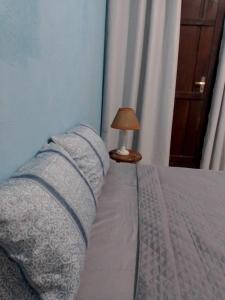Postel nebo postele na pokoji v ubytování Onça Parda Hospedagens com Cachoeira Privativa
