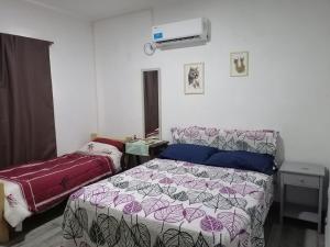 מיטה או מיטות בחדר ב-Casa - Dos habitaciones