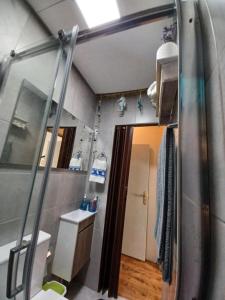 a bathroom with a shower and a sink and a mirror at Casario do Vale Hospedagem e Eventos in Assento +183 photos