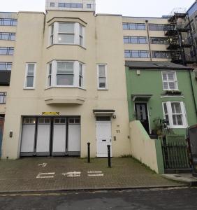 an empty parking lot in front of a building at Elegance at the Lanes-3BD in Brighton & Hove