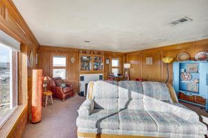 a living room with a couch and a table at Charming Farmington Home about 16 Mi to Aztec Ruins! in Farmington