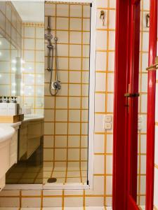 a bathroom with a shower and a sink at Lake Front View on Viale GENO in Como +37 photos