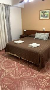 Un pat sau paturi într-o cameră la Hotel LB