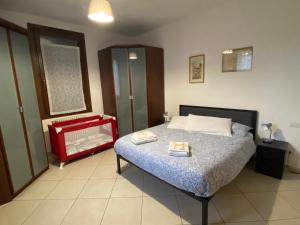 a bedroom with a bed with two towels on it at Il Profumo dei Tigli in Imola