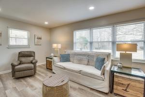 a living room with a couch and a chair at Pet-Friendly Fultondale Home about 9 Mi to Birmingham! in Fultondale
