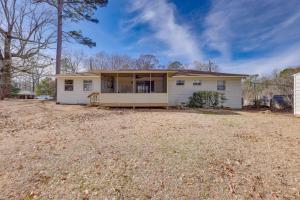 a white house with a yard at Pet-Friendly Fultondale Home about 9 Mi to Birmingham! in Fultondale