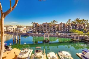 a group of boats docked in a marina at Waterfront Long Beach Condo with Pool Access! in Long Beach