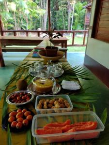 a table with food on top of a table at Casa da Mata Marajó in Salvaterra