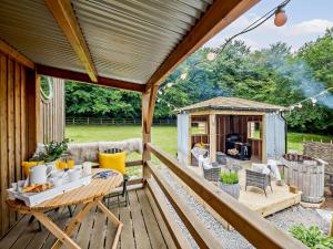 a wooden deck with a gazebo at 1 Bed in Great Torrington 82862 in Sheepwash