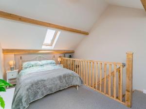 a bedroom with a bed in a attic at 1 Bed in Aberystwyth 83551 in Llanilar