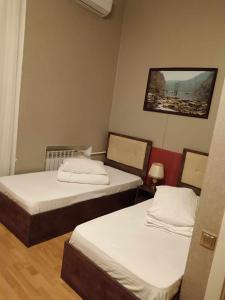 Postel nebo postele na pokoji v ubytování soprano guest house