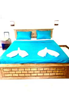 Una cama o camas en una habitación de Lihini Scandic Bungallow