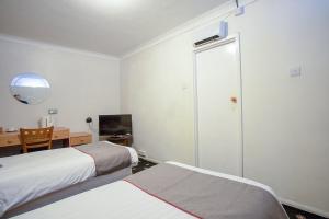 Säng eller sängar i ett rum på Knowesgate Hotel B&B