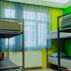 a dorm room with bunk beds and a window at Eroz Hostel Old City in Istanbul