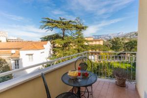 a balcony with a table and a view at L'Arancio house- Perfect for families and groups in Sorrento