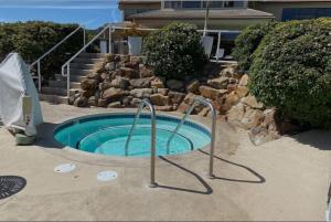 a small swimming pool in front of a house at Seascape Resort Aptos, Capitola, Santa Cruz in Aptos