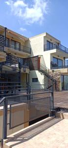 a building with stairs in front of a building at Solar de Roca in Embalse