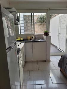 a kitchen with a sink and a counter top at Departamentos Ines 1 in Junín