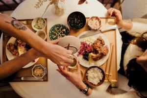 a group of people sitting at a table with food at Mas de Kyoto, Maison d'hôtes l'expérience Japonaise in Dions +30 photos