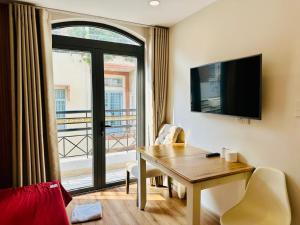 a room with a table and a window with a view at B786 Airport Apartment in Ho Chi Minh City
