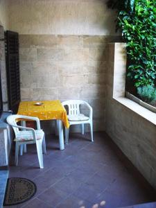 a table and two chairs sitting on a patio at Studio Apartment ''k'' in Pula