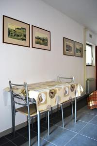 a table and chairs in a room at Studio Apartment ''k'' in Pula