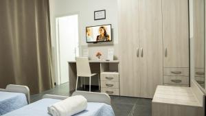 TV a/nebo společenská místnost v ubytování europa bed