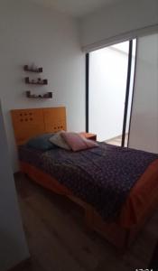 Кровать или кровати в номере Depa Playa Blanca PH