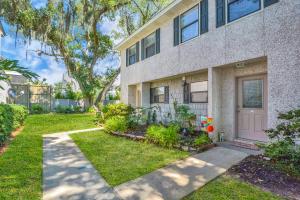 a house with a garden in front of it at Courtyard Villa B-2 in Saint Simons Island