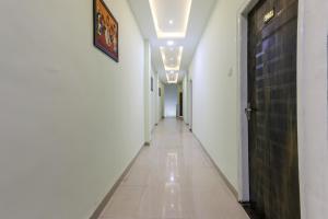 an empty corridor in a building with a hallway at OYO Nabhyansh Elite in Indore
