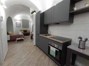 a kitchen with a sink and a counter top at B&B LE MUSE in Barletta