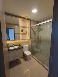 a bathroom with a toilet and a sink and a shower at Departamento Deluxe 2D in Santa Cruz de la Sierra