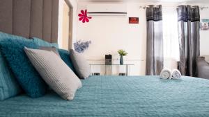 Postel nebo postele na pokoji v ubytování Rowy's appartement