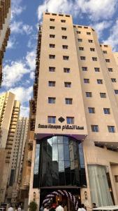 a large building with a sign on the front of it at فندق سما المقام in Jarwal