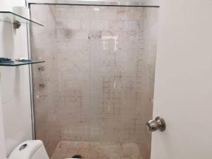 a bathroom with a shower with a toilet at Excelente apto muy cerca de la playa 202 in Mazatlán +15 photos
