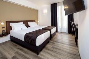 Postel nebo postele na pokoji v ubytování Best Western Hotel Biri