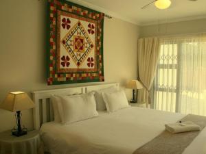 Ένα ή περισσότερα κρεβάτια σε δωμάτιο στο Corner House Accommodation