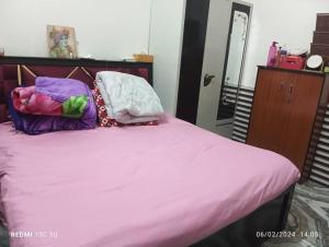 RADHA APARTMENTS Stay客房内的一张或多张床位
