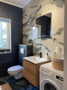 Koupelna v ubytování Apartman “Gušt” + 37 fotografií