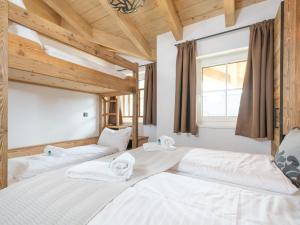 Postel nebo postele na pokoji v ubytování Tauernlodge Mila