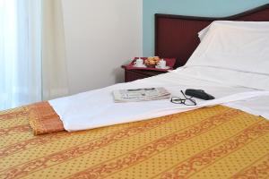 Postel nebo postele na pokoji v ubytování Hotel Vittoria - Nuova Gestione