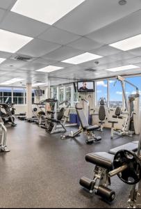 a gym with cardio equipment in a building at Marco Polo Beach Resort Condo with balcony in Sunny Isles Beach