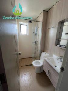 a bathroom with a toilet and a sink at Gembox Homestay near USIM#NETFLIX#WIFI100Mbps in Nilai
