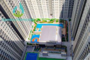a tall building with a pool in the middle of it at Gembox Homestay near USIM#NETFLIX#WIFI100Mbps in Nilai